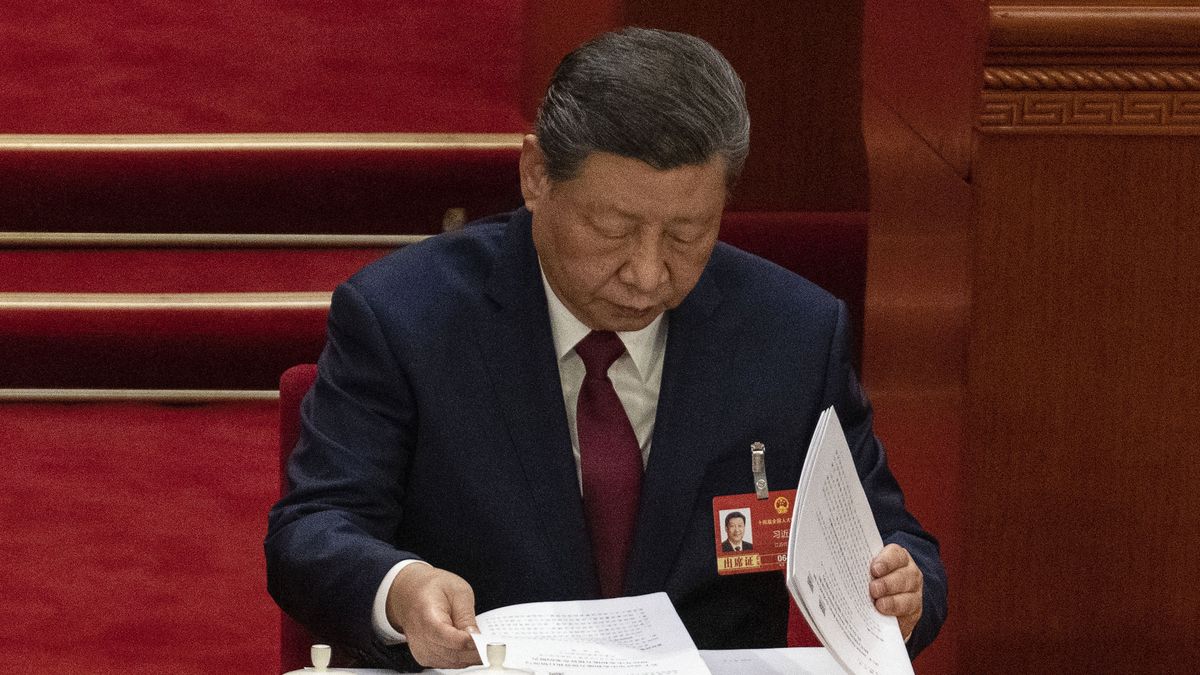 BEIJING, CHINA - MARCH 5: Chinese President Xi Jinping looks at the work report during Premier Li Qiang's speech, at the opening session of the National People's Congress at the Great Hall of the People on March 5, 2026 in Beijing, China. China's annual political gatherings, which includes the important National People's Congress (NPC), and is known as the Two Sessions, convenes leaders and lawmakers to set the government's agenda for domestic economic and social development for the year. The meetings are expected to close by March 12th. (Photo by Kevin Frayer/Getty Images)