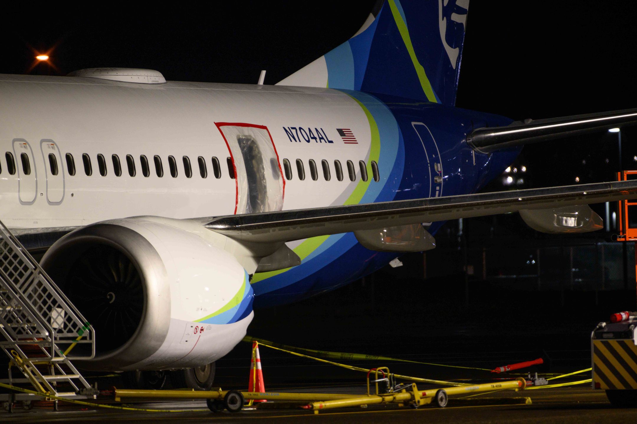 PORTLAND, OREGON - JANUARY 8: A plastic sheet covers an area of the fuselage of the Alaska Airlines N704AL Boeing 737 MAX 9 aircraft outside a hangar at Portland International Airport on January 8, 2024 in Portland, Oregon. NTSB investigators are continuing their inspection on the Alaska Airlines N704AL Boeing 737 MAX 9 aircraft following a midair fuselage blowout on Friday, January 5. None of the 171 passengers and six crew members were seriously injured. (Photo by Mathieu Lewis-Rolland/Getty Images)