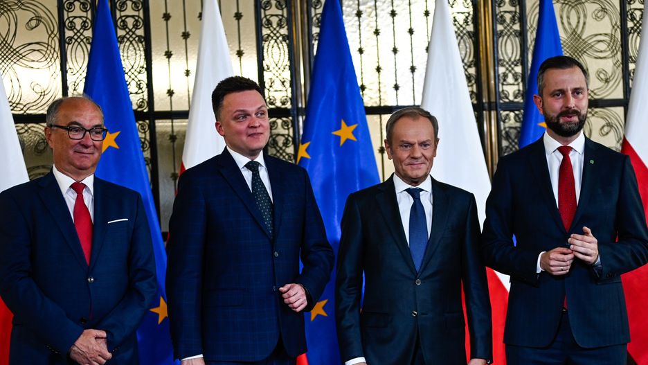 WARSAW, POLAND - OCTOBER 24: One of the leaders of the New Left, Wlodzimierz Czarzasty (L), the leader of Poland 2050 Party, Szymon Holownia (2nd L) , the leader of Civic Coalition (KO), Donald Tusk (2nd R), and the Leader of Polish People's Party (PSL), Wladyslaw Kosiniak Kamysz (R) stand together as they give a press statement in Warsaw, Poland on October 24, 2023. On Tuesday and Wednesday, Oct . 24 and 25 President Andrzej Duda will hold individual consultations with leaders of political parties that have won seats in the parliament of the new term. With the results of the Parliamentary elections out, Poland's democratic opposition made of the Civic Coalition, The Third Way Political alliance, and The New Left has the chance to rule with a majority and all have refused to enter a coalition with the ruling government party, Law and Justice. (Photo by Omar Marques/Anadolu via Getty Images)