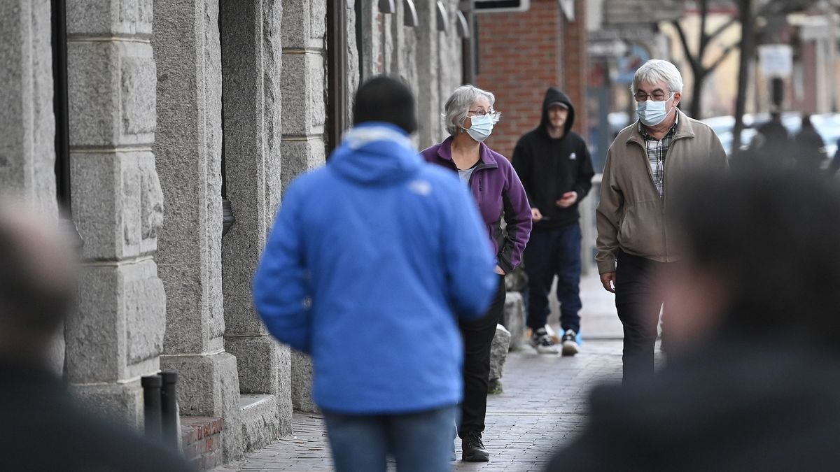 PORTLAND, ME - NOVEMBER 11: Pedestrians walk along a crowded Commercial St. in Portland Thursday, November 11, 2021. (Shawn Patrick Ouellette/Portland Press Herald via Getty Images)