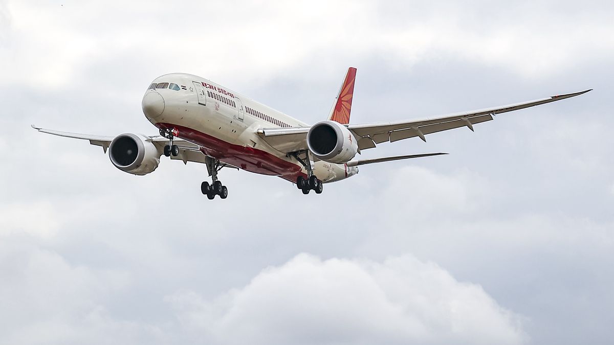 Air India Boeing 787 Dreamliner aircraft as seen on final approach flying for landing at London Heathrow airport during a cloudy day over Myrtle Avenue, a famous planespotting location. The modern and advanced Boeing 787-8 wide body passenger plane has the registration VT-ANW and is powered by 2x GE jet engines. Air India is the Indian flag carrier with headquarters at New Delhi and member of Star Alliance aviation group. Air India is owned by Tata Group, formerly AirIndia Limited was owned by the Government of India. London Heathrow Airport LHR, United Kingdom on August 2022 (Photo by Nicolas Economou/NurPhoto via Getty Images)