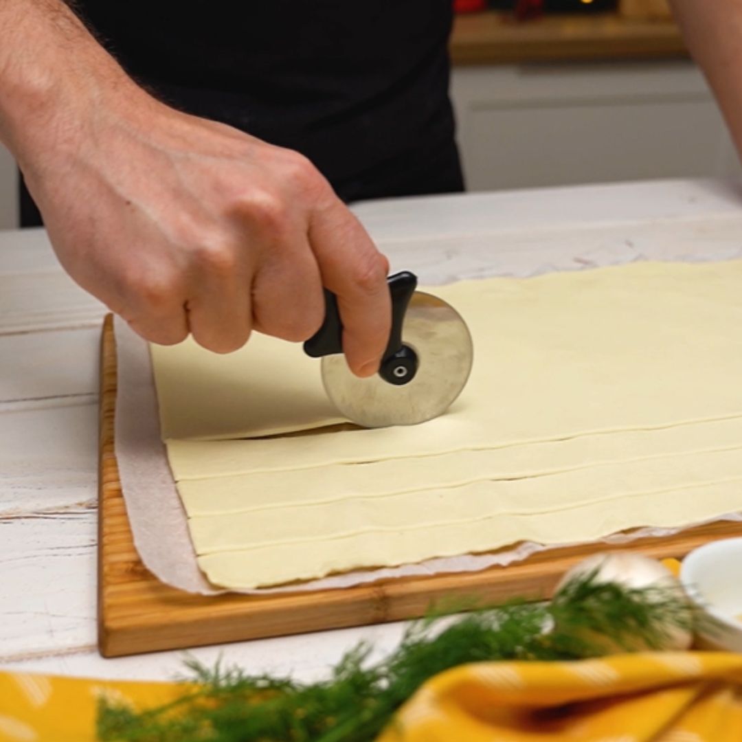 I divide the puff pastry into horizontal strips.