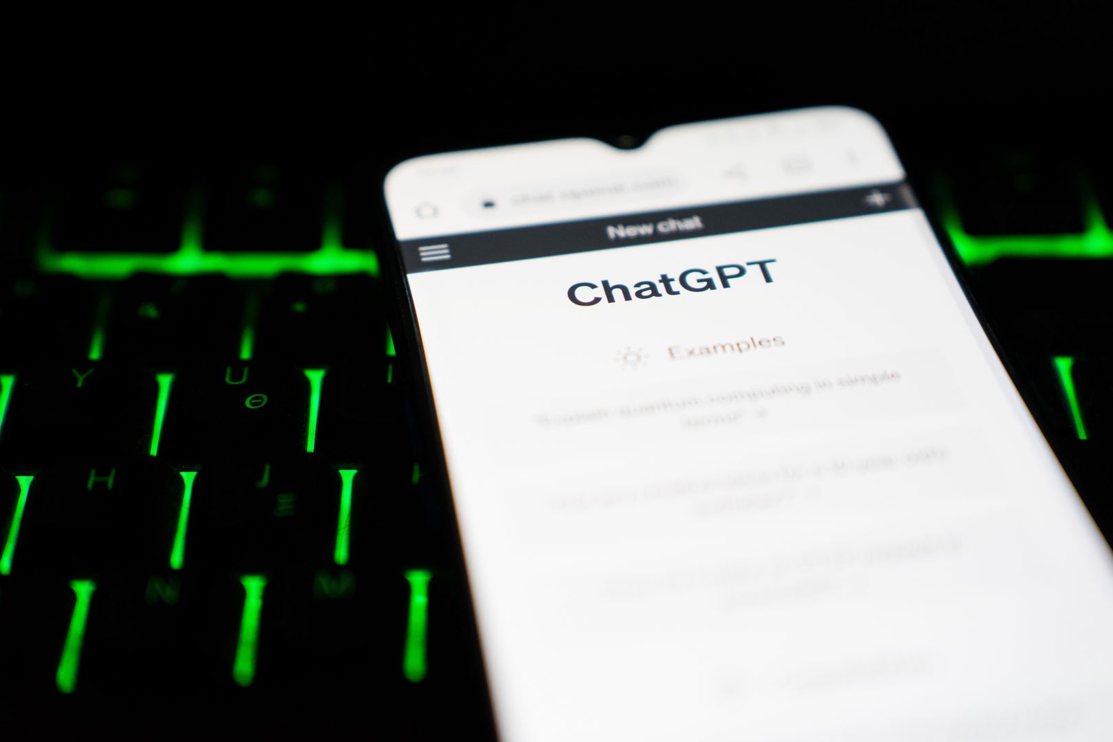 ChatGPT user interface is seen on a smartphone screen over a keyboard. (Photo by Nikos Pekiaridis/NurPhoto via Getty Images)
