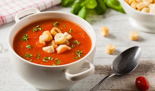 Traditional tomato soup, served with croutons. Front view.
