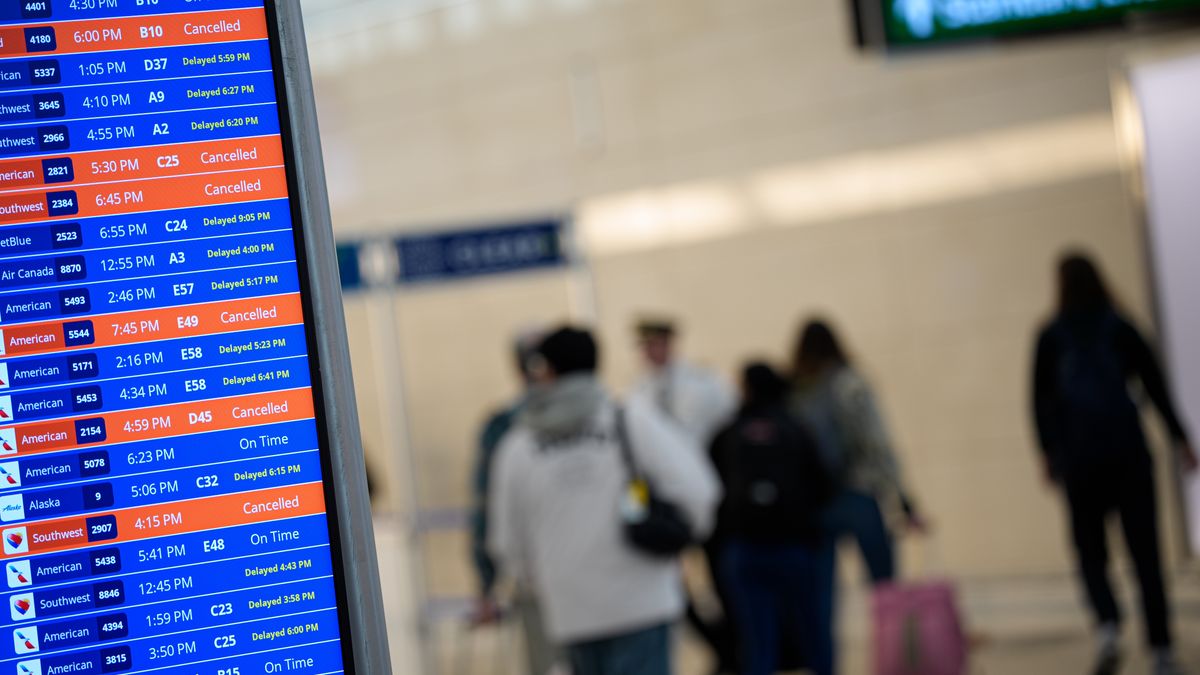 ARLINGTON, VIRGINIA - MARCH 16: A departure board displays multiple canceled and delayed flights at Ronald Reagan Washington National Airport on March 16, 2026 in Arlington, Virginia. Parts of the Eastern U.S. are expected to get severe rain and wind as a storm system moves through the area. (Photo by Andrew Harnik/Getty Images)