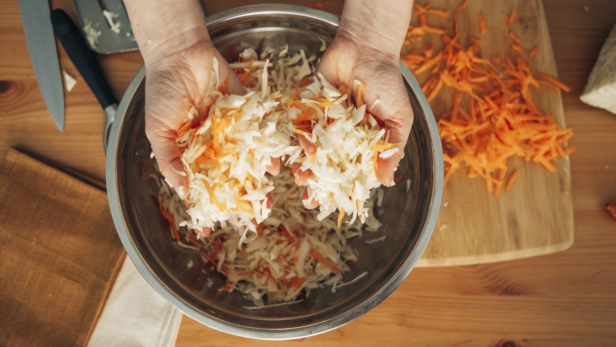 Woman's hands mixing cabbage salad or sauerkraut in a metal bowl
Woman's hands mixing cabbage salad or sauerkraut in a metal bowl.Fermented product. Woman's hands close up, top view
Ekaterina  Vasileva-Bagler