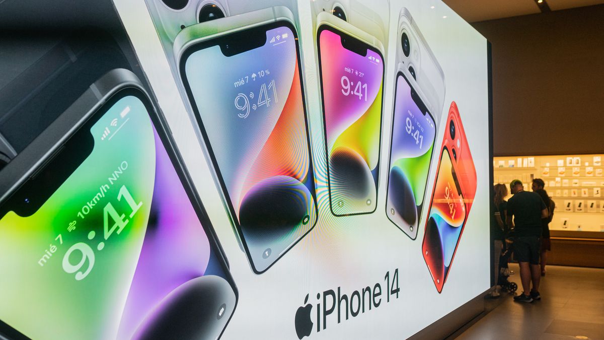 Apple users test the new iPhone 14 in the store before buying it, in Barcelona, Spain, on September 16, 2022. (Photo by Marc Asensio/NurPhoto via Getty Images)
