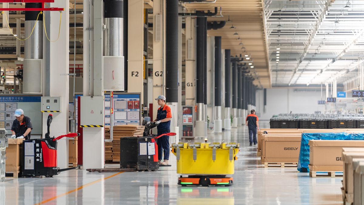 YIWU, CHINA - JUNE 17: An intelligent robot transports components of M252 engine at the workshop of Zhejiang Yili Automobile Components Co., Ltd. on June 17, 2025 in Yiwu, Zhejiang Province of China. The M252 engine, which was jointly developed by Geely Automobile and Mercedes-Benz, will be exported to Germany. (Photo by VCG/VCG via Getty Images)