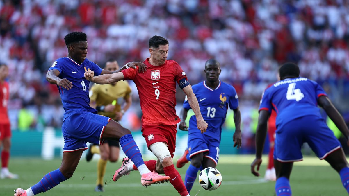 DORTMUND, GERMANY - JUNE 25: Robert Lewandowski of Poland and Aurelien Tchouameni of France battle for the ball during the UEFA EURO 2024 group stage match between France and Poland at Football Stadium Dortmund on June 25, 2024 in Dortmund, Germany. (Photo by sportinfoto/DeFodi Images via Getty Images)