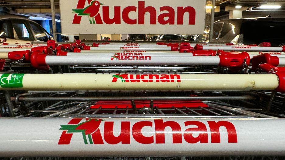 Auchan logos are seen on shopping trolleys near the supermarket in Krakow, Poland on August 1, 2024. (Photo by Jakub Porzycki/NurPhoto via Getty Images)