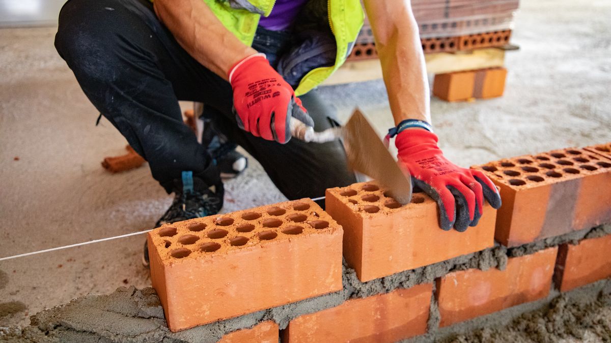 AVILA, CASTILLLA Y LEON, SPAIN - APRIL 10: A worker works on a home during the visit of the Minister for Housing and the Urban Agenda, Isabel Rodriguez, to the 40 collaborative housing units for young people, on 10 April, 2026 in Avila, Castilla y Leon, Spain. During the visit, the Minister for Housing and the Urban Agenda, Isabel Rodriguez, got first-hand knowledge of this new affordable rental model, aimed at facilitating the emancipation of young people and strengthening the public housing stock. She also highlights the value of institutional collaboration to fix the young population in the city of Avila. (Photo By Rafael Bastante/Europa Press via Getty Images)