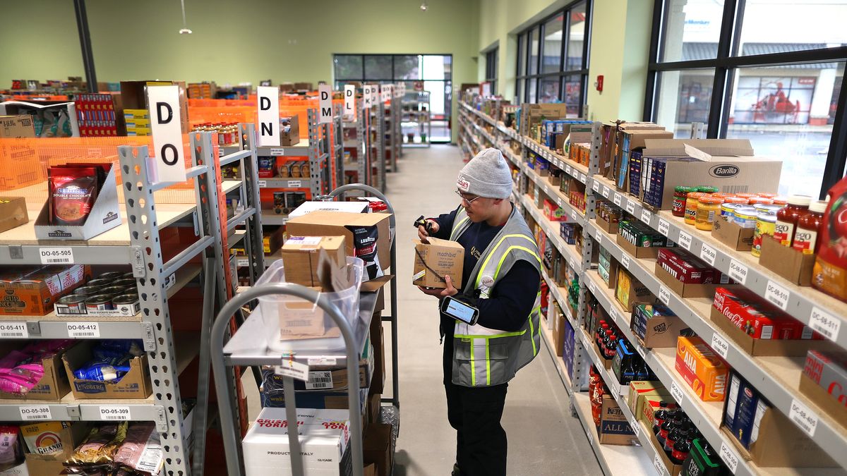 Norwood, MA - January 25: Worker Paul Nguyen stocks shelves inside Addies, a drive-up only grocery store. They opened their first location in Norwood and have shelves and shelves stocked with every grocery item conceivable, and huge freezers and refrigerators with fresh produce and fruits and meats and frozen food. (Photo by John Tlumacki/The Boston Globe via Getty Images)