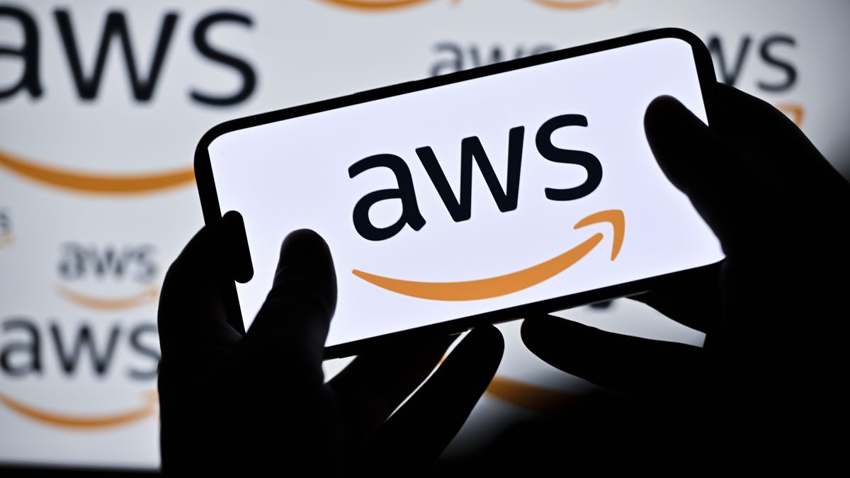 ANKARA, TURKIYE - DECEMBER 10: In this photo illustration the logo of AWS (Amazon Web Services) is being displayed on a mobile phone in Ankara, Turkiye on December 10, 2025. (Photo by Ismail Kaplan/Anadolu via Getty Images)