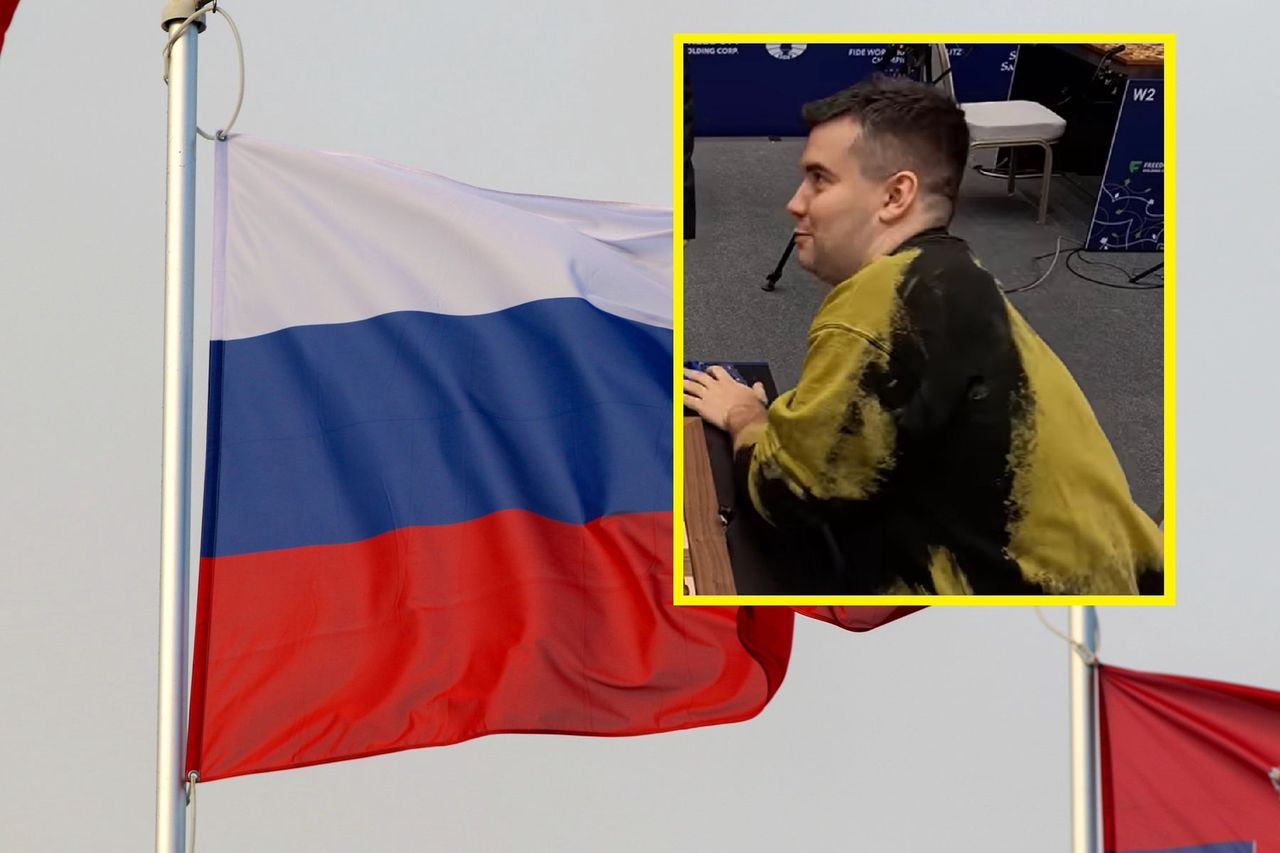 In the photo: Jan Niepomniaszczij against the backdrop of the Russian flag.