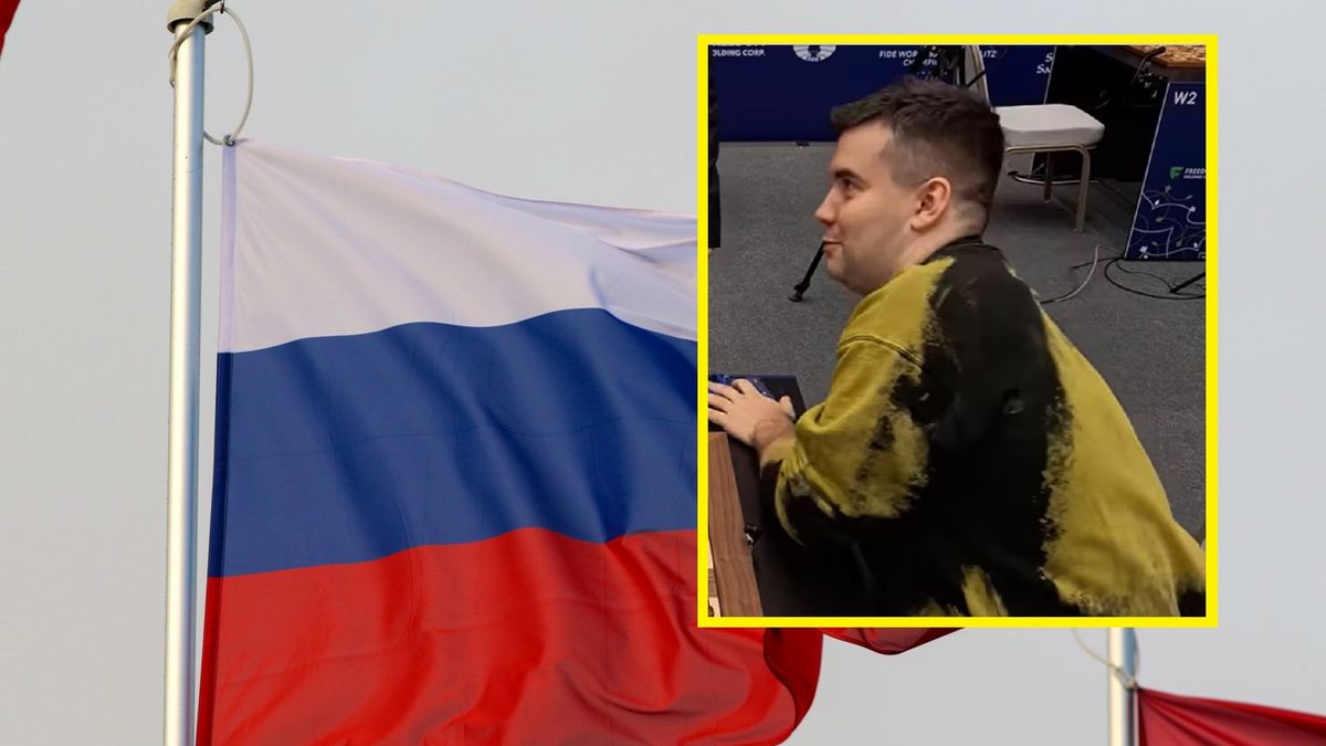 Na zdjęciu: Jan Niepomniaszczij na tle flagi Rosji