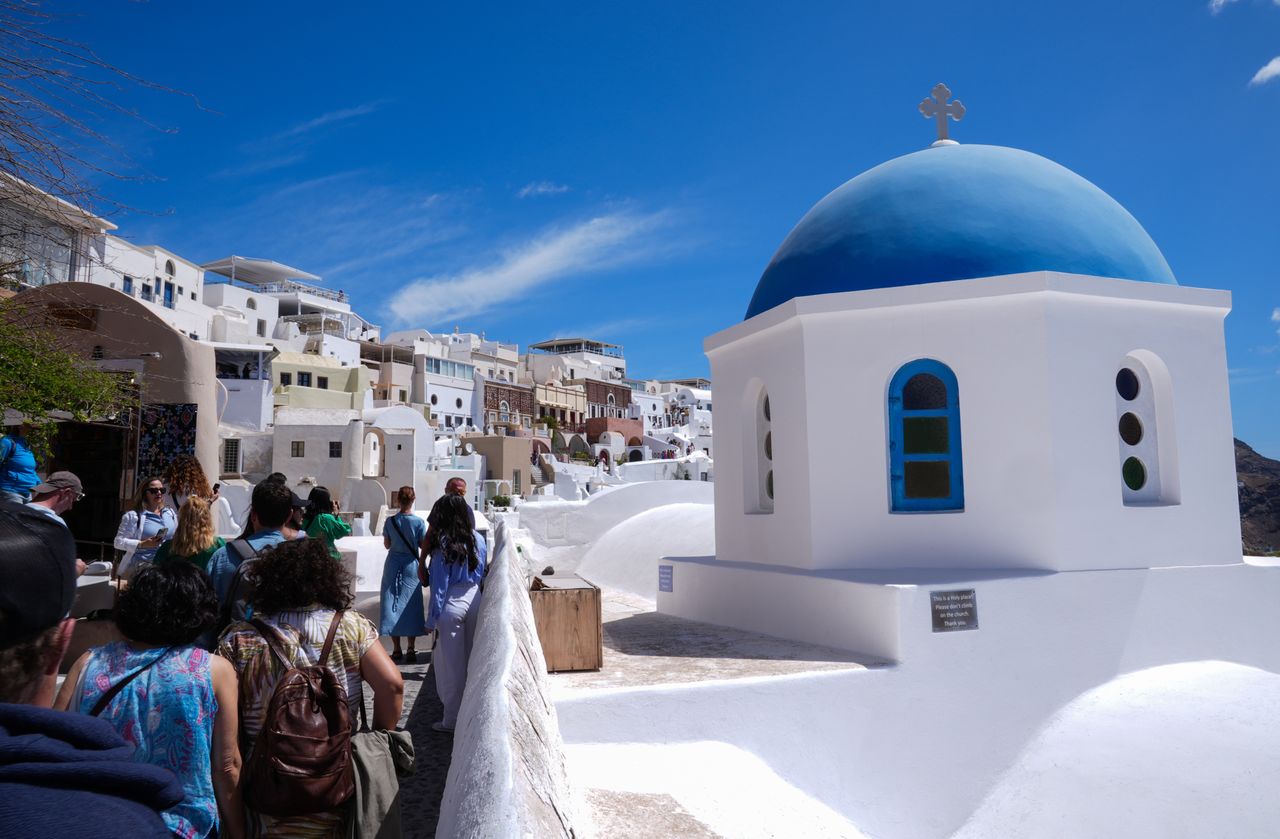 Santorini locals urged to stay home amid tourist surge