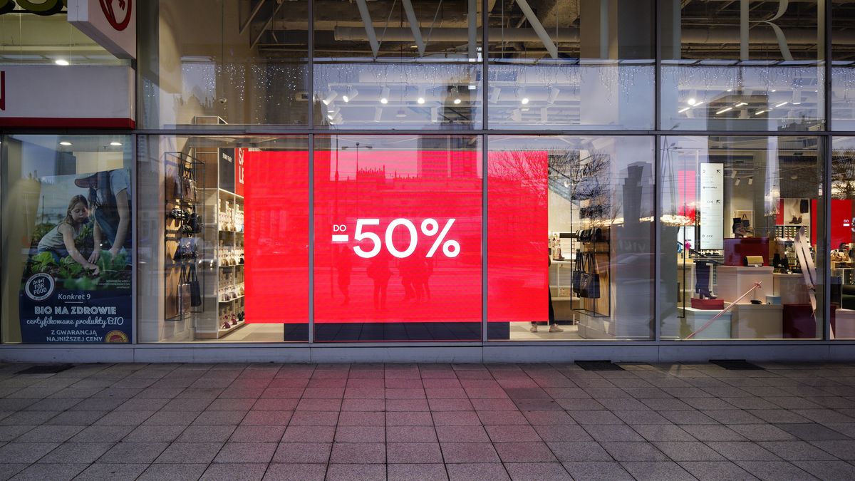 A sign in a closed shop is seen advertising a 50 percent off sale in Warsaw, Poland on December 29, 2020. (Photo by Jaap Arriens/NurPhoto via Getty Images)