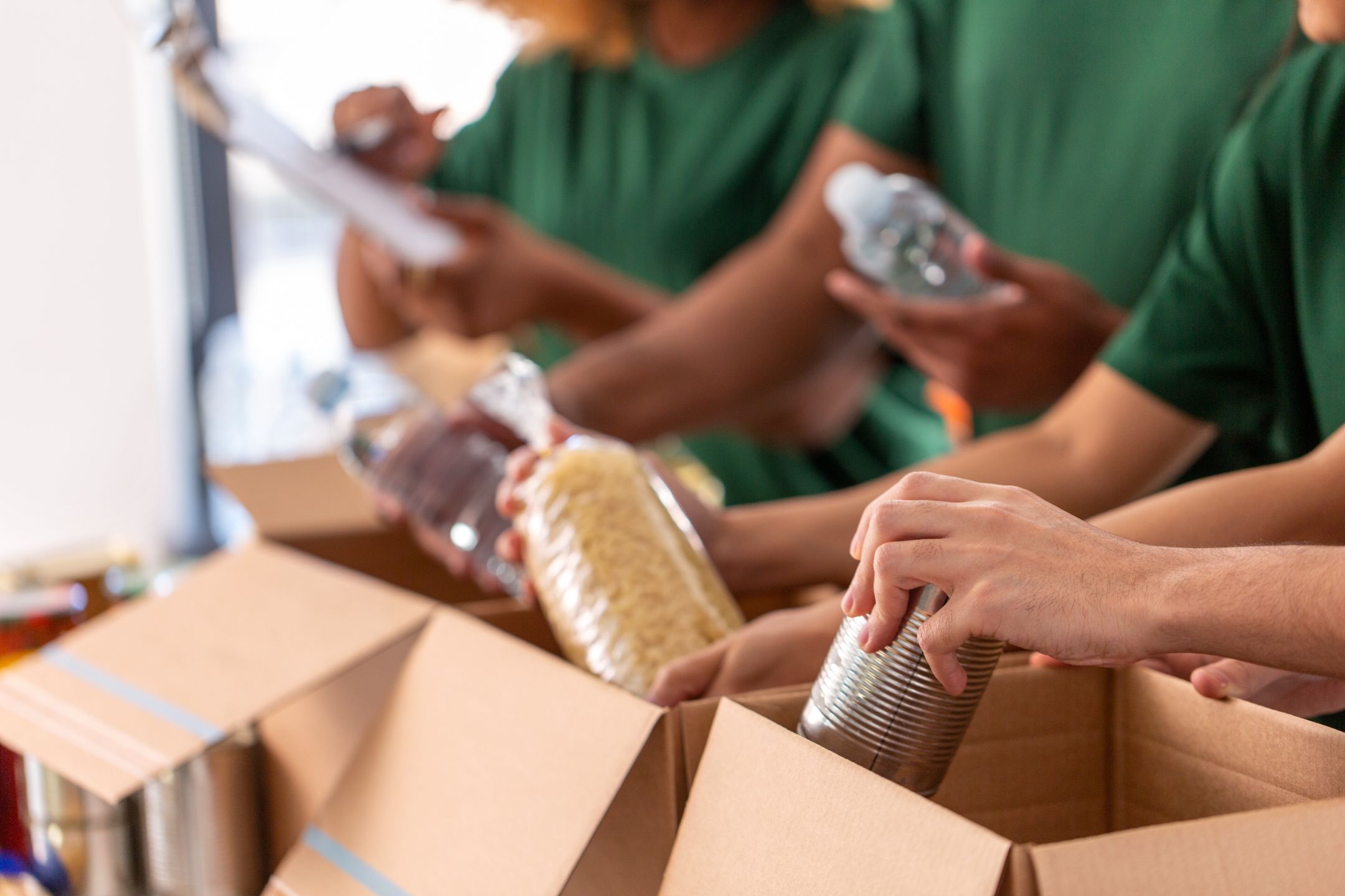 close up of volunteers packing food in boxes
charity, donation and volunteering concept - close up of international group of happy smiling volunteers packing food in boxes at distribution or refugee assistance center
lev dolgachov
volunteer, donation, charity, food, volunteering, humanitarian, aid, relief, work, box, people, grocery, groceries, distribution, refugee, assistance, center, response, international, team, group, support, care, help, meal, packing, foodstuff, fund, nonprofit, donating, giving, sharing, social, goods, product, concept, female, male, man, woman, multiethnic, multiracial, young, indoors, worker, job, closeup