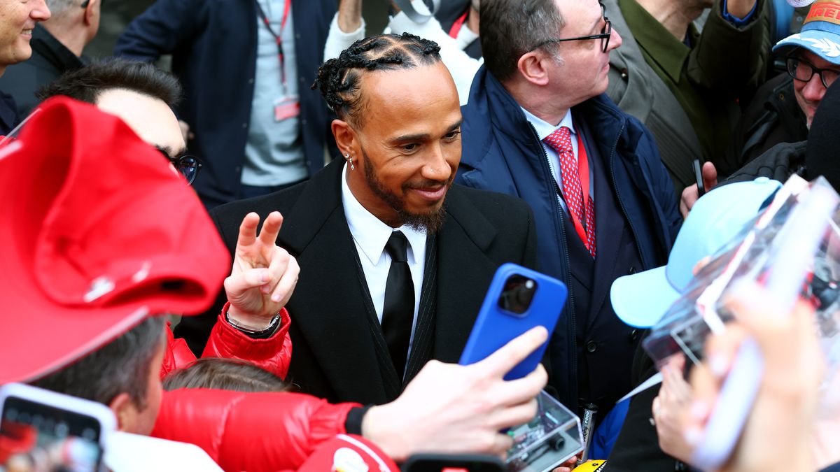 FIORANO MODENESE, ITALY - JANUARY 20: Sir Lewis Hamilton greets fans during his first official days as a Scuderia Ferrari F1 driver at Fiorano Circuit on January 20, 2025 in Fiorano Modenese, Italy. (Photo by Clive Rose/Getty Images)