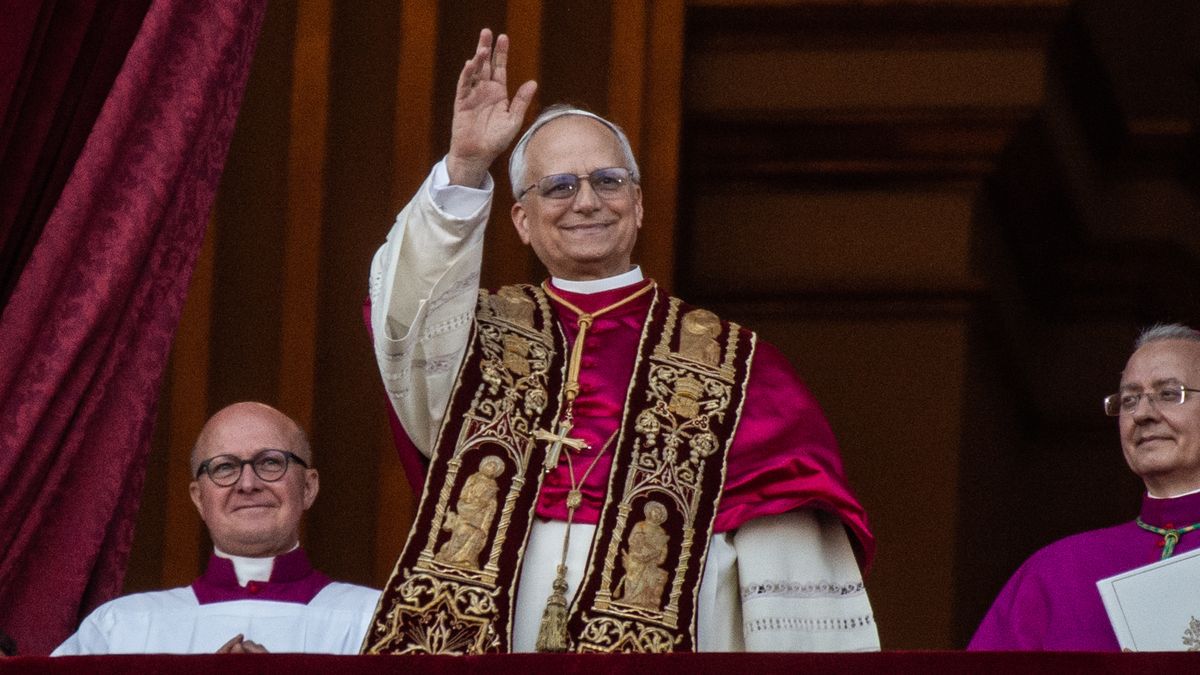 VATICAN CITY, VATICAN - MAY 08: Pope Leo XIV greets the crowd from St. Peter's Basilica after being elected by the conclave on May 08, 2025 in Vatican City, Vatican. White smoke was seen over the Vatican early this evening as the Conclave of Cardinals took just two days to elect Cardinal Robert Francis Prevost, who will be known as Pope Leo (Leone) XIV, as the 267th Supreme Pontiff after the death of Pope Francis on Easter Monday. (Photo by Ivan Romano/Getty Images)