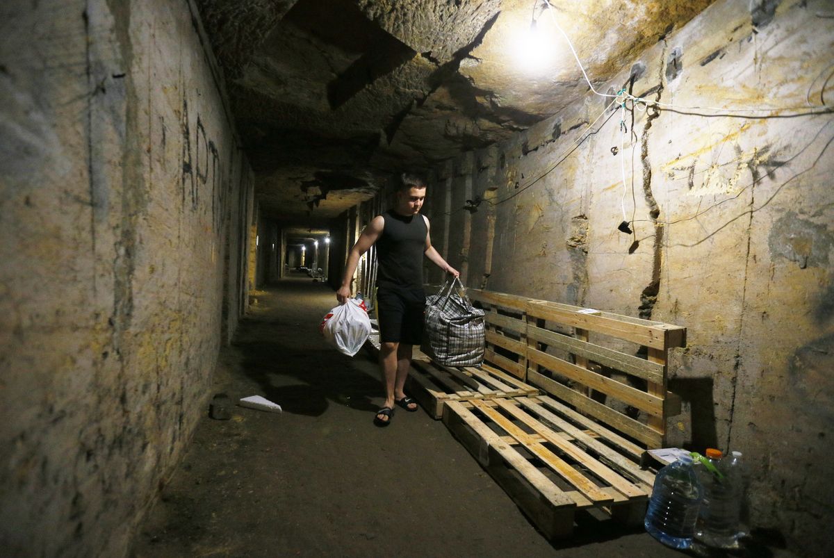 People take shelter in the catacombs using it as a bomb shelter during air raid alert, amid Russia's invasion of Ukraine, in Odesa, Ukraine 29 June 2022. The catacombs in Odesa are a labyrinth-like network of tunnels and subterranean cavities located under the city and its outskirts. It is one of the world's largest urban labyrinths, running up to 2,500 kilometres, parts were used as air-raid shelters during the Second World War, as media informed.  (Photo by STR/NurPhoto via Getty Images)