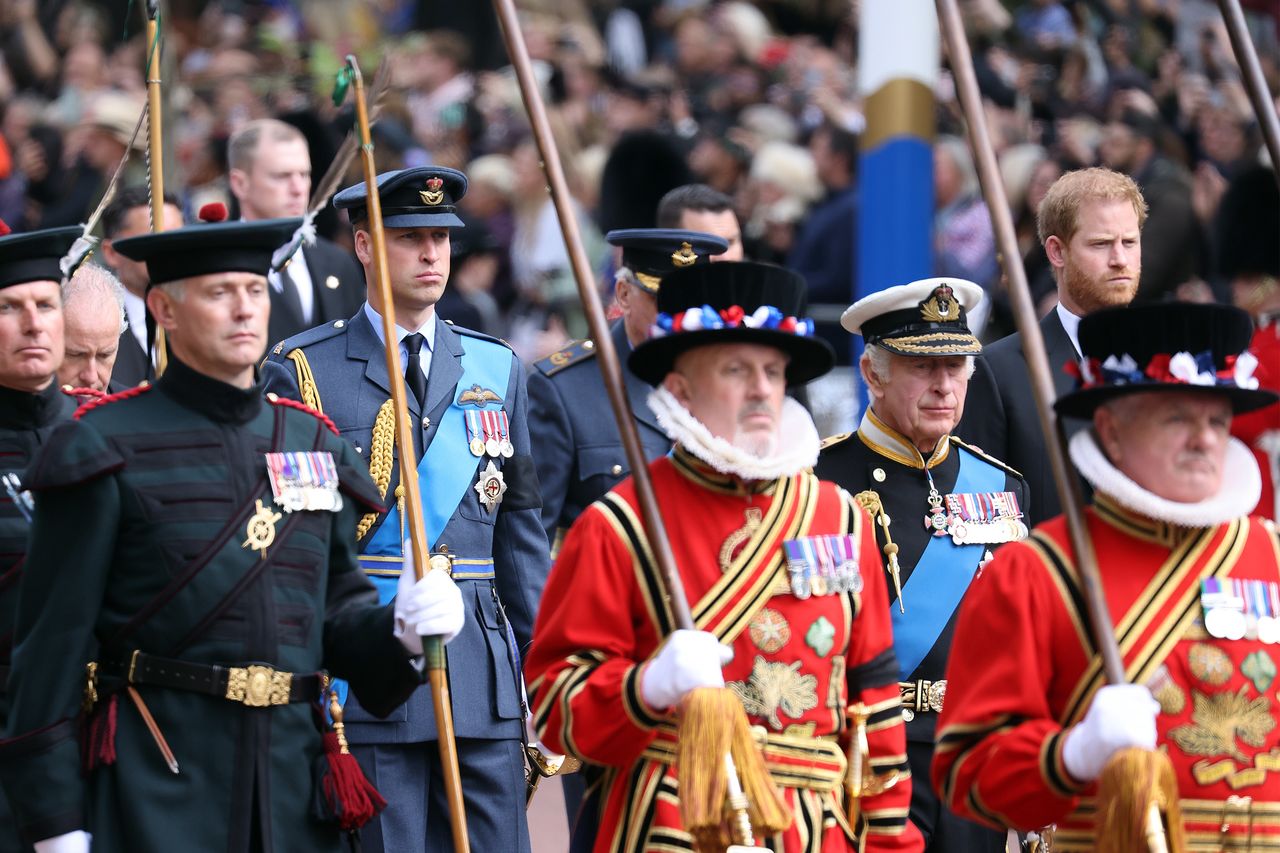 LONDON, ENGLAND - SEPTEMBER 19: King Charles III, Prince William, Prince of Wales and Prince Harry during the procession of the coffin towards Buckingham Palace following the State Funeral of Queen Elizabeth II at Westminster Abbey on September 19, 2022 in London, England.  Elizabeth Alexandra Mary Windsor was born in Bruton Street, Mayfair, London on 21 April 1926. She married Prince Philip in 1947 and ascended the throne of the United Kingdom and Commonwealth on 6 February 1952 after the death of her Father, King George VI. Queen Elizabeth II died at Balmoral Castle in Scotland on September 8, 2022, and is succeeded by her eldest son, King Charles III. (Photo by Neil Mockford/Getty Images)