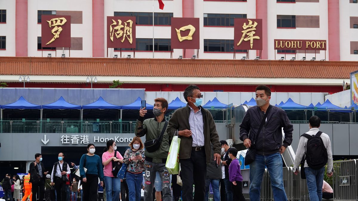 SHENZHEN, CHINA - FEBRUARY 12: Travelers cross Luohu Port and arrive at a square on February 12, 2023 in Shenzhen, Guangdong Province of China. Hong Kong and the Chinese mainland resumed full cross-boundary travel on February 6. (Photo by VCG/VCG via Getty Images)
