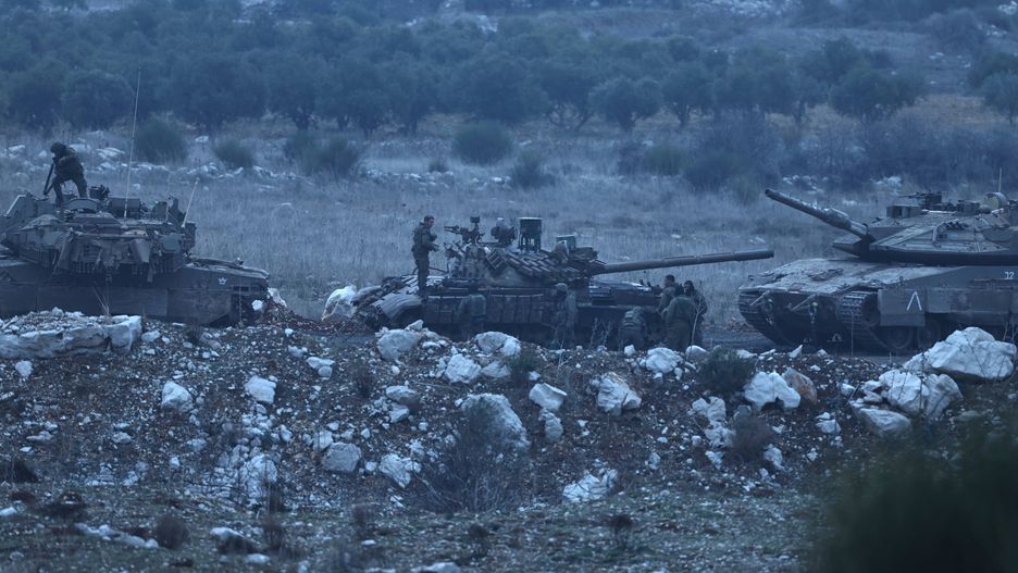 Israel boosts troop presence on Golan Heights amid developments in Syria
epa11788669 Israeli soldiers stand near a Syrian T-72 tank inside the buffer zone prior to transfer it into Israel, on the border between Israel and Syria, near the Druze village of Majdal Shams, in the Israeli-annexed Golan Heights, 21 December 2024. Israel's military said that its troops are conducting 'defense activities' along the border with Syria in the Golan Heights, northern Golan Heights, and Mount Hermon, to prevent 'any threat' from 'terrorist elements' in the area.  EPA/ATEF SAFADI 
Dostawca: PAP/EPA.
ATEF SAFADI
Israeli, military, tank, buffer zone, Syria border