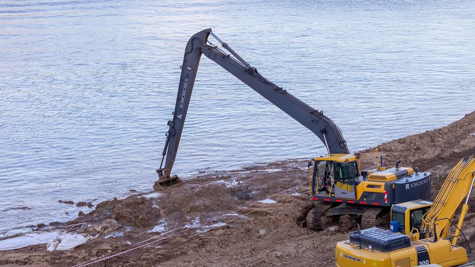 Long-arm excavator dredging riverbank with construction equipment nearby.
Long-arm excavator digging along muddy riverbank, realistic photo style, natural water backdrop, concept of dredging and construction work
excavator, dredging, construction, river, digging, machinery, equipment, water, mud, engineering, site, realistic, hydraulic, soil, industrial, vehicle, worksite, track, sand, bucket, operator, jobsite, heavy, yellow, mechanical, dirt, landscape, outdoor, civil, loader, trench, terrain, ground, shore, foundation, earthmoving, contractor, project, development, infrastructure, scoop, arm, tool, environment, machinerywork, digger, backhoe, building, effort, excavator, dredging, construction, river, digging, machinery, equipment, water, mud, engineering, site, realistic, hydraulic, soil, industrial, vehicle, worksite, track, sand, bucket, operator, jobsite, heavy, yellow, mechanical, dirt, landscape, outdoor, civil, loader, trench, terrain, ground, shore, foundation, earthmoving, contractor, project, development, infrastructure, scoop, arm, tool, environment, machinerywork, digger, backhoe, building, effort
