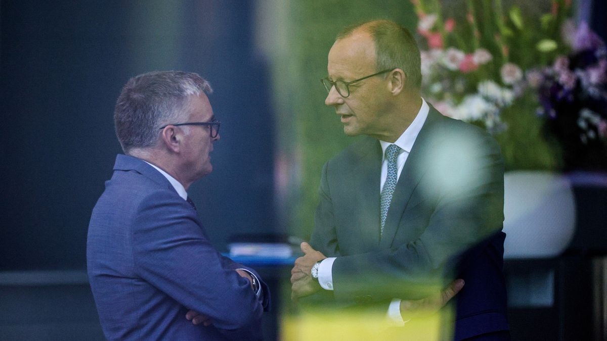 BERLIN, GERMANY - JUNE 11: German Chancellor Friedrich Merz (R) chats with German Government Spokesman Stefan Kornelius as he waits for the arrival of Danish Prime Minister Mette Frederiksen at the chancellery on June 11, 2025 in Berlin, Germany. Both Denmark and Germany support Ukraine strongly with military aid. (Photo by Omer Messinger/Getty Images)
