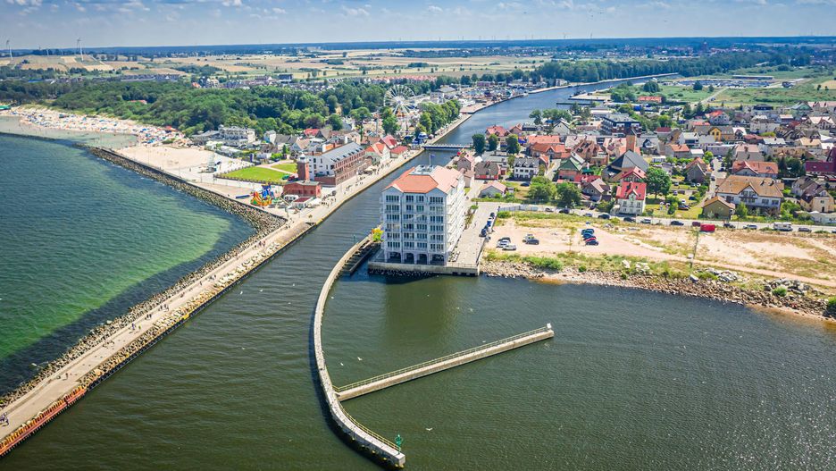 Aerial view of port in Darlowek on Baltic Sea, Poland
2D9TY6C Aerial view of port in Darlowek on Baltic Sea, Poland 
Dostawca: PAP/Alamy
Jacek Nowak / Alamy Stock Photo
above, aerial, aerial, baltic, Ba�tyk, beach, beach, beautiful, blue, coast, coastal, Darlowko, Darlowo, drone, europe, holiday, laguna, landscape, morze ba�tyckie, nature, outdoor, people, pier, poland, polish, sand, scenic, sea, seashore, seaside, shore, sky, summer, sunny, tourism, travel, vacation, view, water, wave