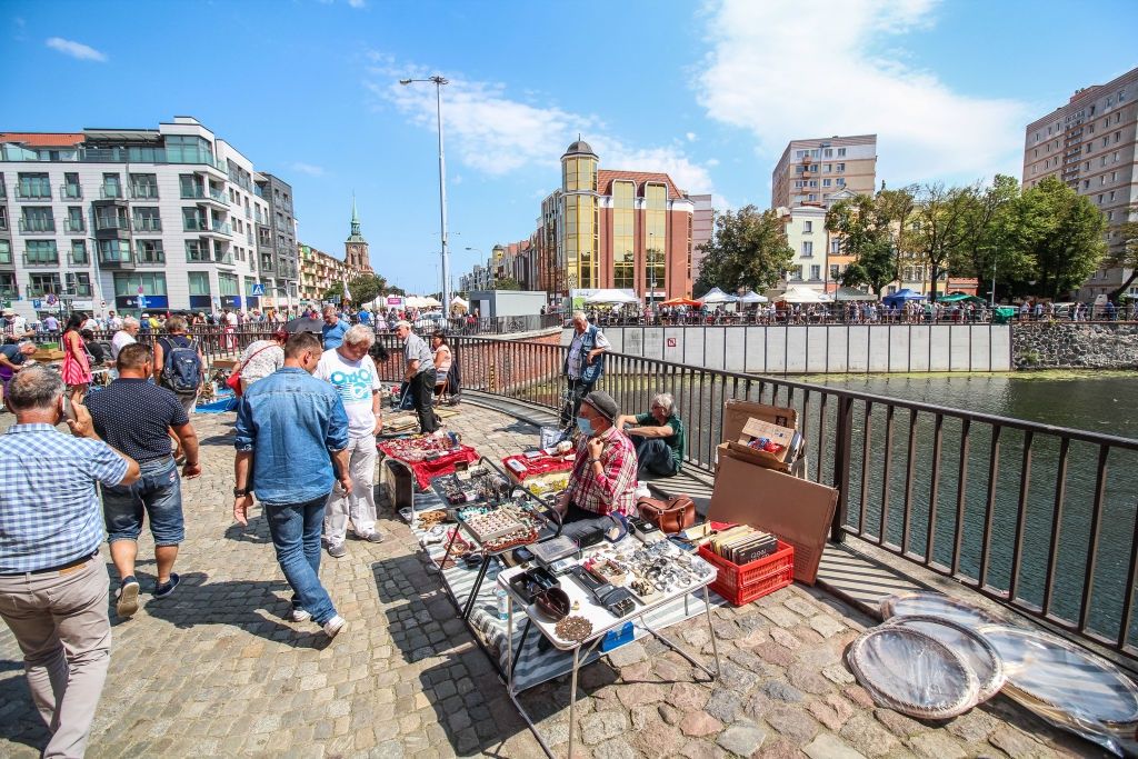760th St. Dominic's Fair in Gdansk, PolandPeople  looking for goods on on stalls and stands on the Old Town streets (some of them wearing face masks due the Covid-19 pandemic) during 760th edition of St. Dominic's fair are seen in Gdansk, Poland on 26 July 2020 Traders, artists and collectors participate in the Fair occupying with their stands several streets in the centre of the in the historical city centre. St. Dominics Fair is the largest open-air trade and cultural event in Poland and one of the largest such events in Europe. In 2020 due the coronavirus there is over 30 percent less traders than usual. (Photo by Michal Fludra/NurPhoto via Getty Images)NurPhotocorona, sars-cov-2, pandemic, st. dominic's fair, st domonics fair, jarmark dominikanski, jarmark sw dominika