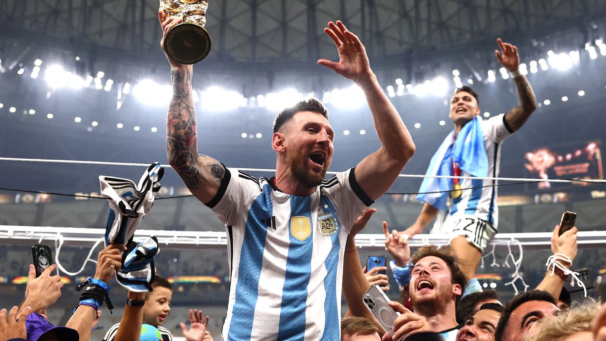 LUSAIL CITY, QATAR - DECEMBER 18: Lionel Messi of Argentina celebrates with the FIFA World Cup trophy following the FIFA World Cup Qatar 2022 Final match between Argentina and France at Lusail Stadium on December 18, 2022 in Lusail City, Qatar. (Photo by Chris Brunskill/Fantasista/Getty Images)