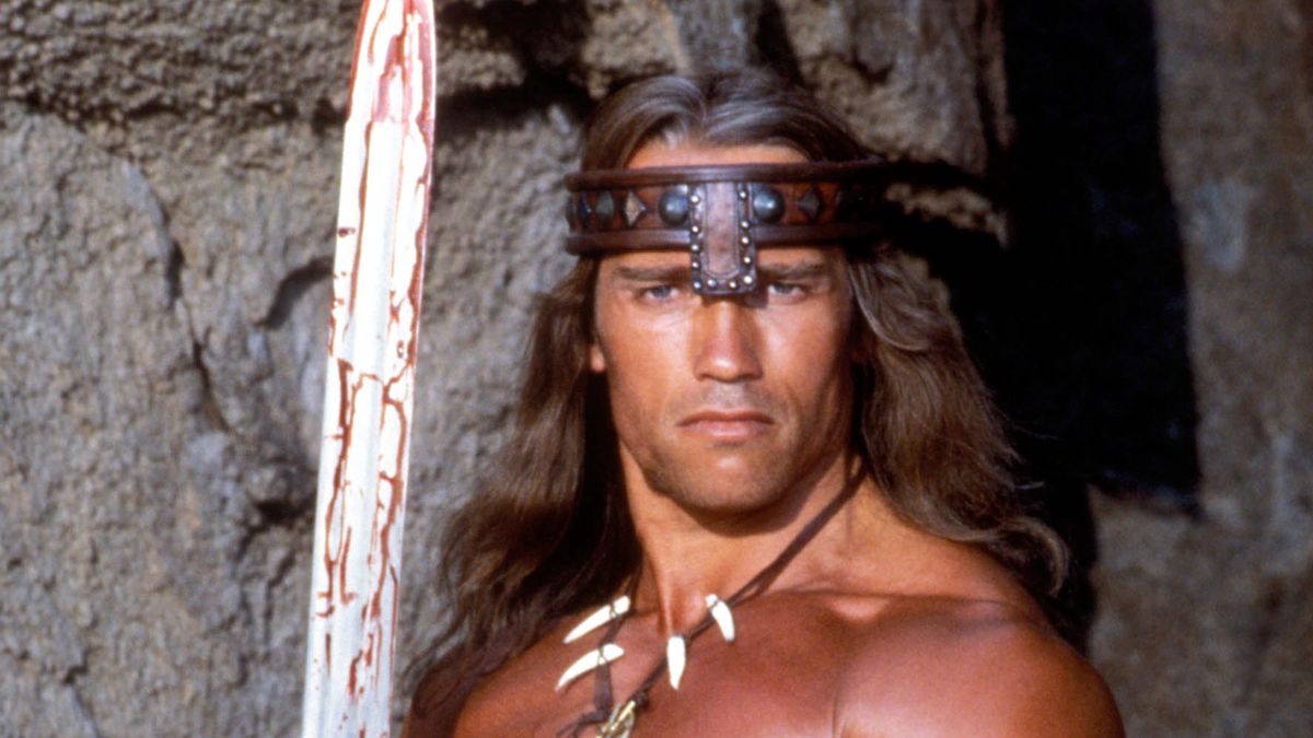 "CONAN THE DESTROYER" 1984ARNOLD SCHWARZENEGGER "CONAN THE DESTROYER" 1984 DINO DE LAURENTIIS PRODUCTIONS/UNIVERSAL. PICTURE: GEORGE WHITEAR-MPTV/LFI REF 5440_0028 *RESTRICTED* Dostawca: PAP/LFIGEORGE WHITEAR-MPTV3/4 Length, Action, Color, Fantasy, Headband, Loin Cloth, Muscles, Shirtless, Sword, Teeth Necklace