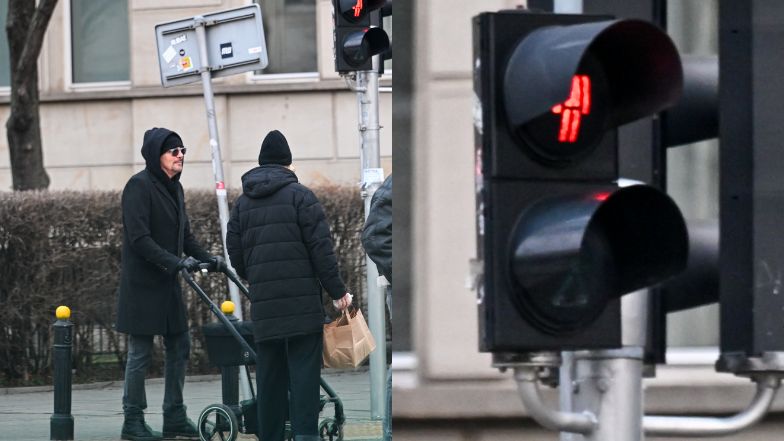 Krzysztof Ibisz przechodzi z żoną i córką na czerwonym świetle