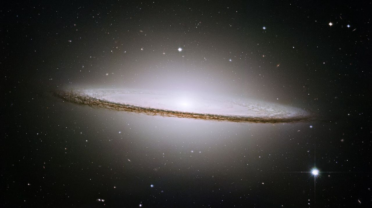 Astronomer discovers elusive 'Iris Galaxy' hidden within the Sombrero Galaxy