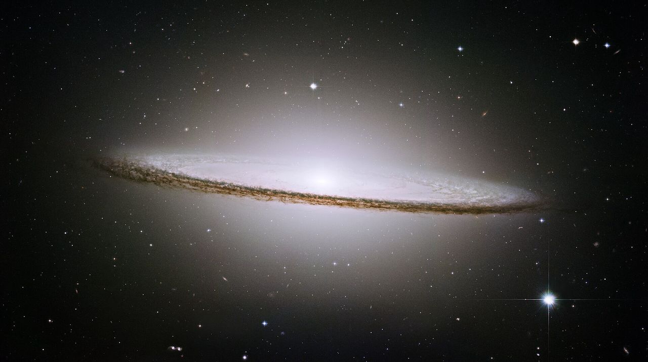 Astronomer discovers elusive 'Iris Galaxy' hidden within the Sombrero Galaxy