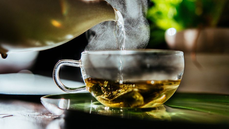 Fresh hot water for organic sage herbal tea at teatime.