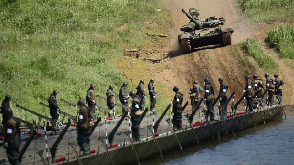 Pontoon-bridge units hold exercises in Primorye TerritoryPRIMORYE TERRITORY, RUSSIA. JUNE 25, 2015. A T-62 tank seen by a pontoon bridge during military exercises conducted by the 5th Army's pontoon bridge units on organization and maintenance of assault troop and bridge crossings on the grounds of a firing range in the village of Sergeyevka. Yuri Smityuk/TASS,Image: 250931187, License: Rights-managed, Restrictions: , Model Release: no, Credit line: Yuri Smityuk / TASS / ForumYuri Smityuk / TASS / Forumdrill, training, crossing, military, floating bridge, category_code_war