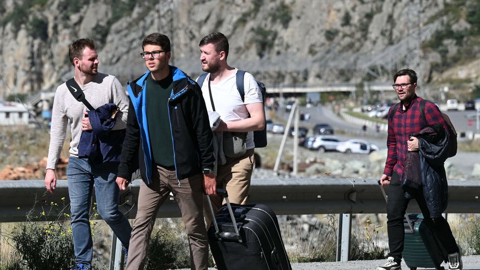 Temporary
Russians arrive in Georgia after crossing the Kazbegi / Verkhniy Lars border crossing point on September 28, 2022. - The latest wave of Russian exiles since the conflict began in February has seen military-aged men pour into the Caucasus country, by cars in a column stretching for some 20 kilometres, by bicycles and some walking kilometres by foot to the border crossing. (Photo by Vano SHLAMOV / AFP)
VANO SHLAMOV