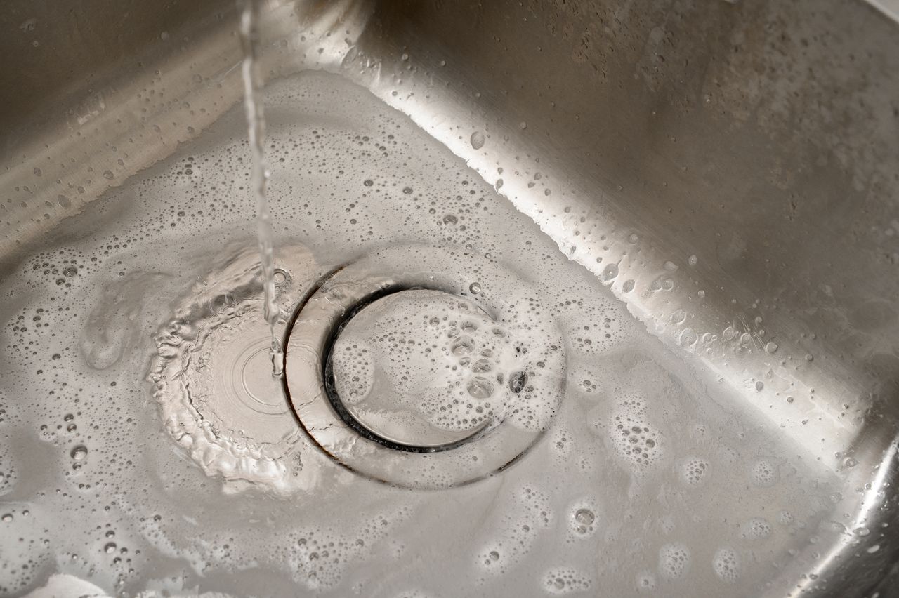 Citric acid will deal with a clogged sink.