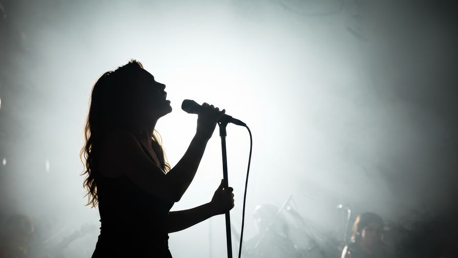 singer, silhouette, microphone, woman, female, stage, concert, music, performance, performing, live, artist, entertainment, rock, pop, band, song, sing, musician, musical, show, light, dark, audience, event, crowd, vocalist, passion, expressive, talent, artistic, spotlight