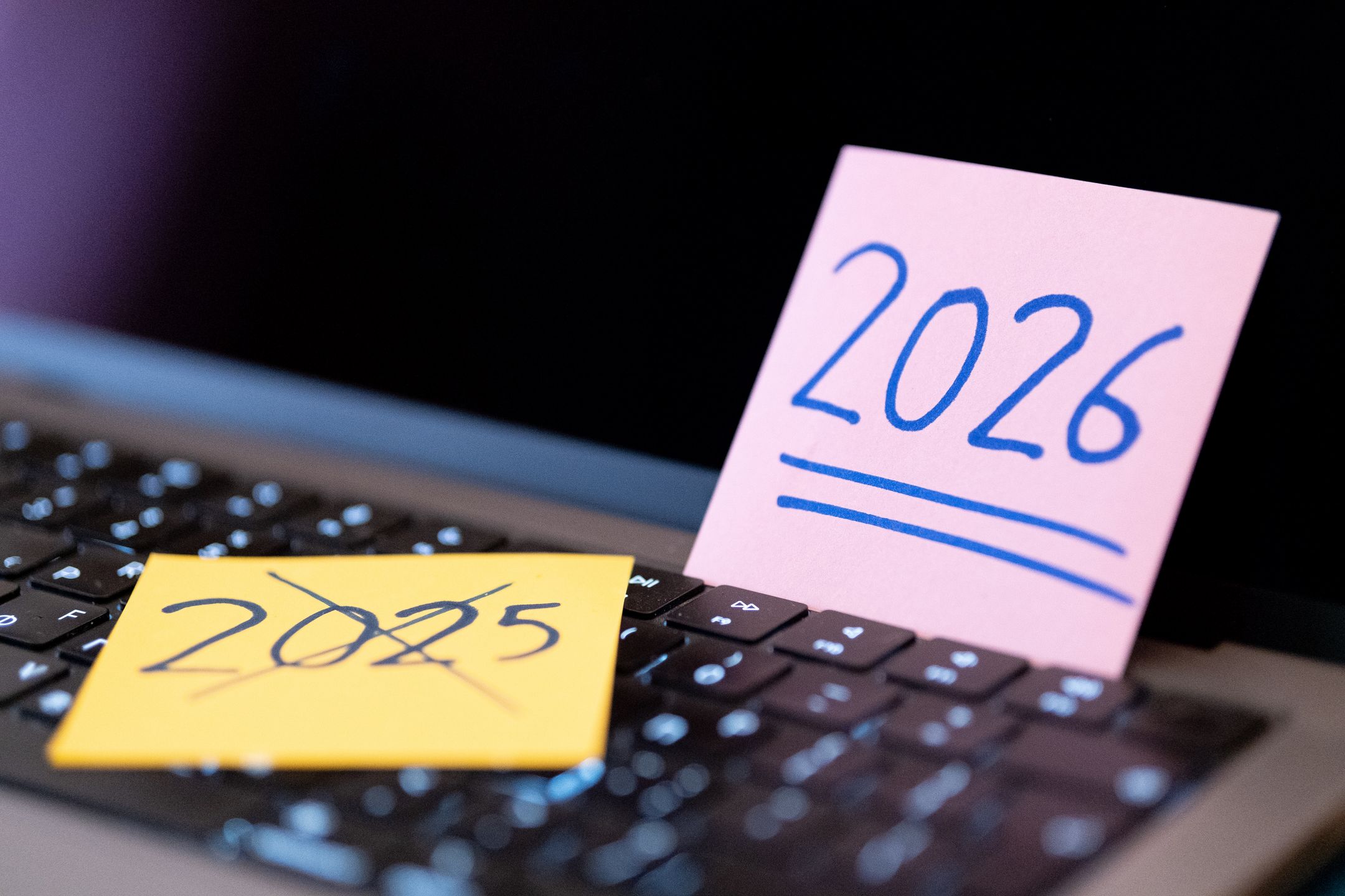 A sticky note shows the year 2026, and a sticky note shows the year 2025 crossed out, symbolizing the transition to a new year in Athens, Greece, on December 24, 2025. (Photo by Nikolas Kokovlis/NurPhoto via Getty Images)