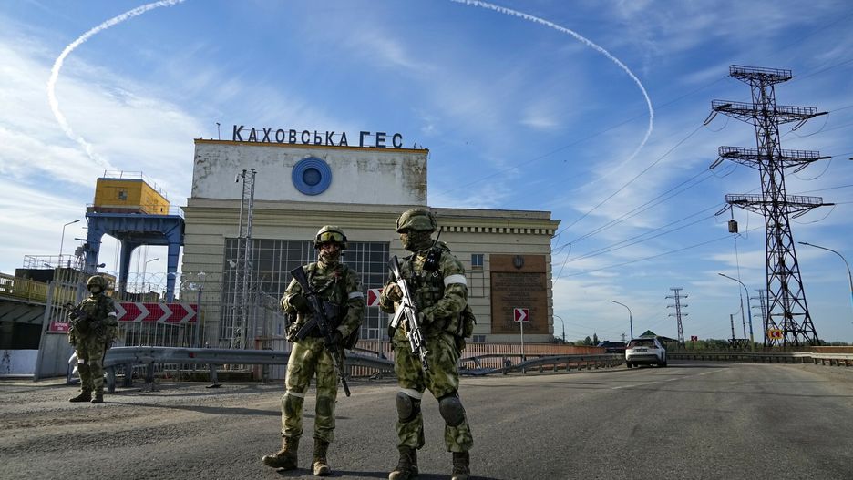 TemporaryRussian troops guard an entrance of the Kakhovka Hydroelectric Station, a run-of-river power plant on the Dnieper River in Kherson region, south Ukraine, Friday, May 20, 2022. The Kherson region has been under control of the Russian forces since the early days of the Russian military action in Ukraine. This photo was taken during a trip organized by the Russian Ministry of Defense. (AP Photo)AP