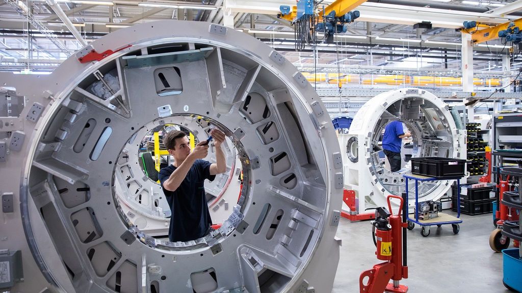 An employee works on the gantry of a Somatom computerized tomography (CT) scanner machine on the assembly line at the Siemens AG Healthineers factory in Forchheim, Germany, on Wednesday, July 19, 2017. Siemens said it's moving ahead with a planned split from its health-care division as Europe's largest engineering company whittles down its core holdings to focus on energy and factory equipment. Photographer: Krisztian Bocsi/Bloomberg via Getty Images
Bloomberg
Manufacturing, Europe, EMEA, Industry, EU, Best Photo, Fabrication, E.U., Best Photos