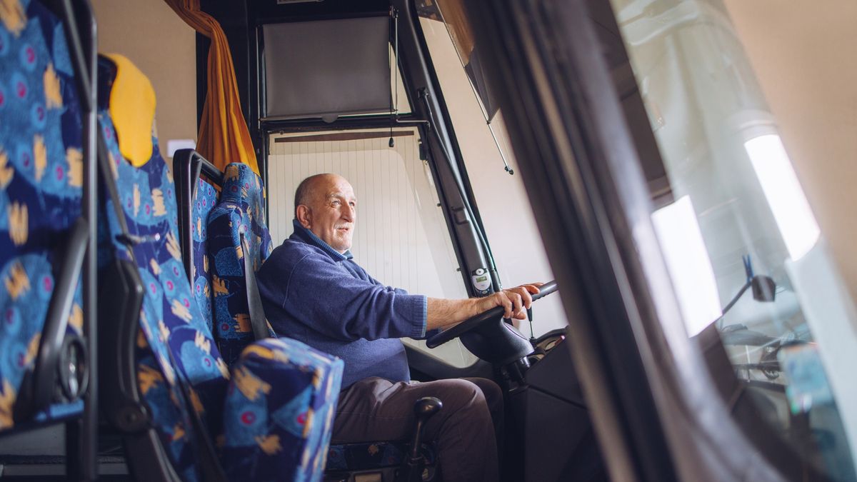 Senior male driver driving bus
Senior man sits behind the wheel of a bus and drives a bus.
Ika84