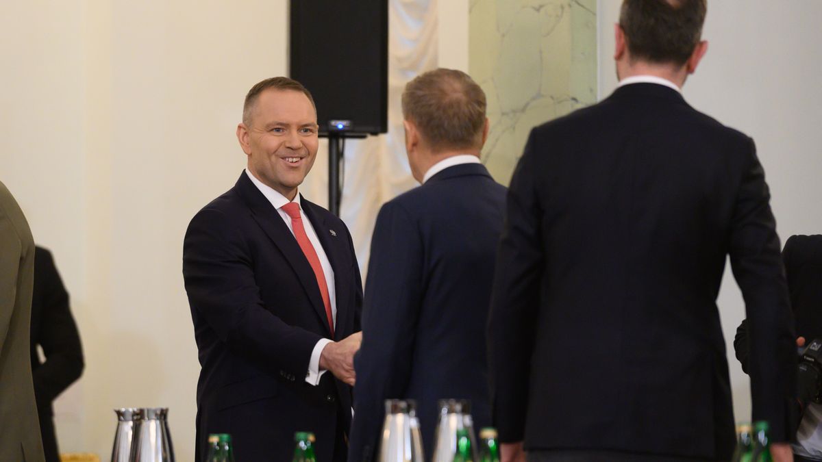 Poland's President Karol Nawrocki shakes hands with Polish Prime Minister Donald Tusk as they take part in the National Security Council meeting called to discuss EU defense loans and Trump's Board of Peace in Warsaw, Poland, on February 11, 2026. (Photo by Aleksander Kalka/NurPhoto via Getty Images)