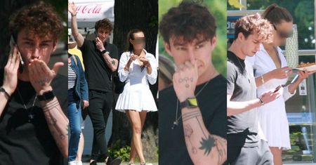 Marcin Dubiel spaceruje w Sopocie w towarzystwie TAJEMNICZEJ BRUNETKI i macha do paparazzi (ZDJĘCIA)