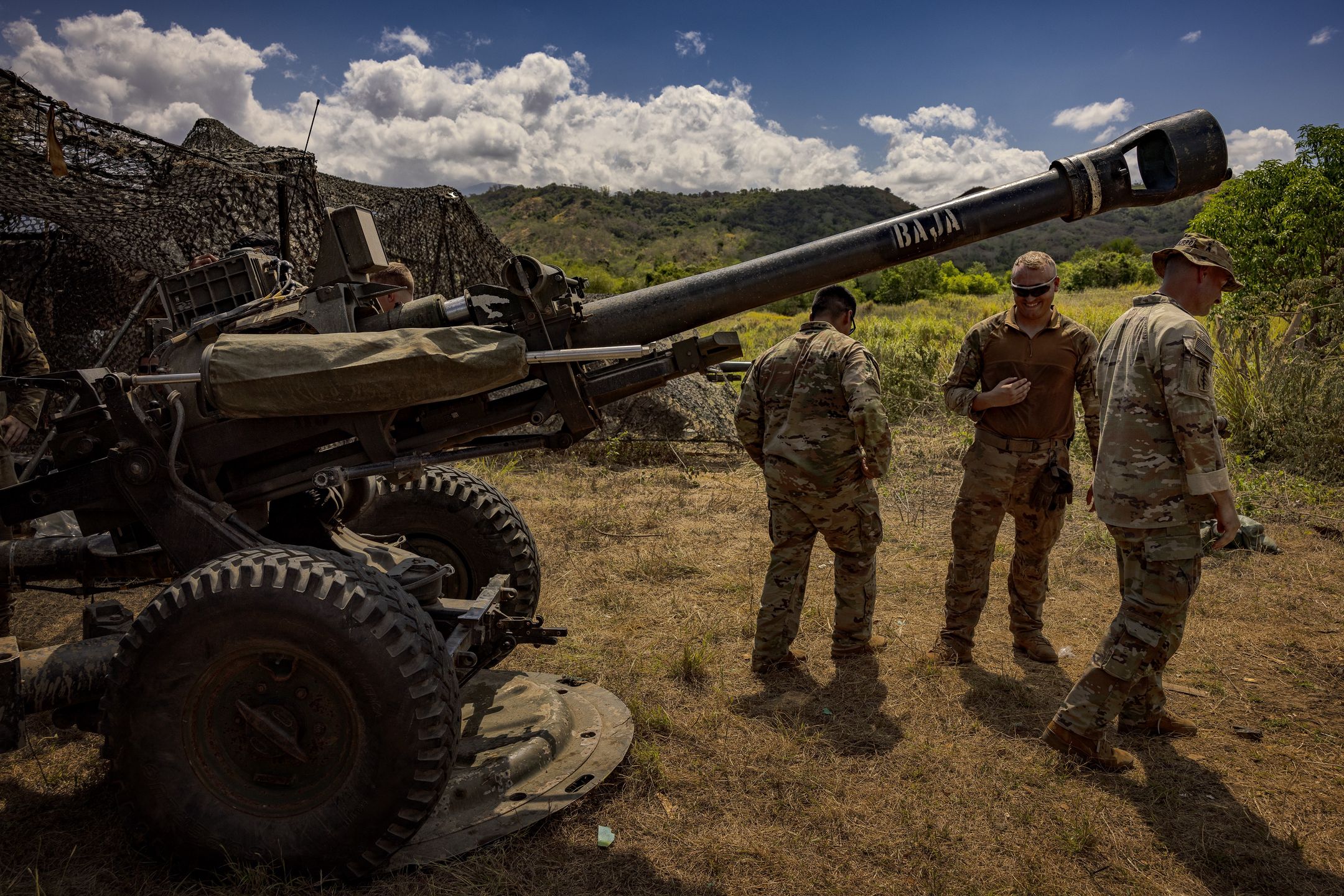 LAUR, PHILIPPINES - APRIL 26: US Army troops stand next to a M119 Howitzer during a live fire exercise as part of US-Philippines army-to-army joint drills on April 26, 2024 in Laur, Nueva Ecija province, Philippines. The Philippines and the United States initiated their largest Balikatan (shoulder-to-shoulder) joint military exercises, involving 16,000 troops, with drills extending beyond the Philippines' territorial sea into the contentious South China Sea, directly opposing China's broad claims. The exercises also include drills in the Philippines' northern Cagayan province, near Taiwan. These war games follow a significant trilateral summit in Washington involving the US, Japan, and the Philippines, where President Joe Biden reiterated US defense commitments in the event of a South China Sea conflict.  (Photo by Ezra Acayan/Getty Images)