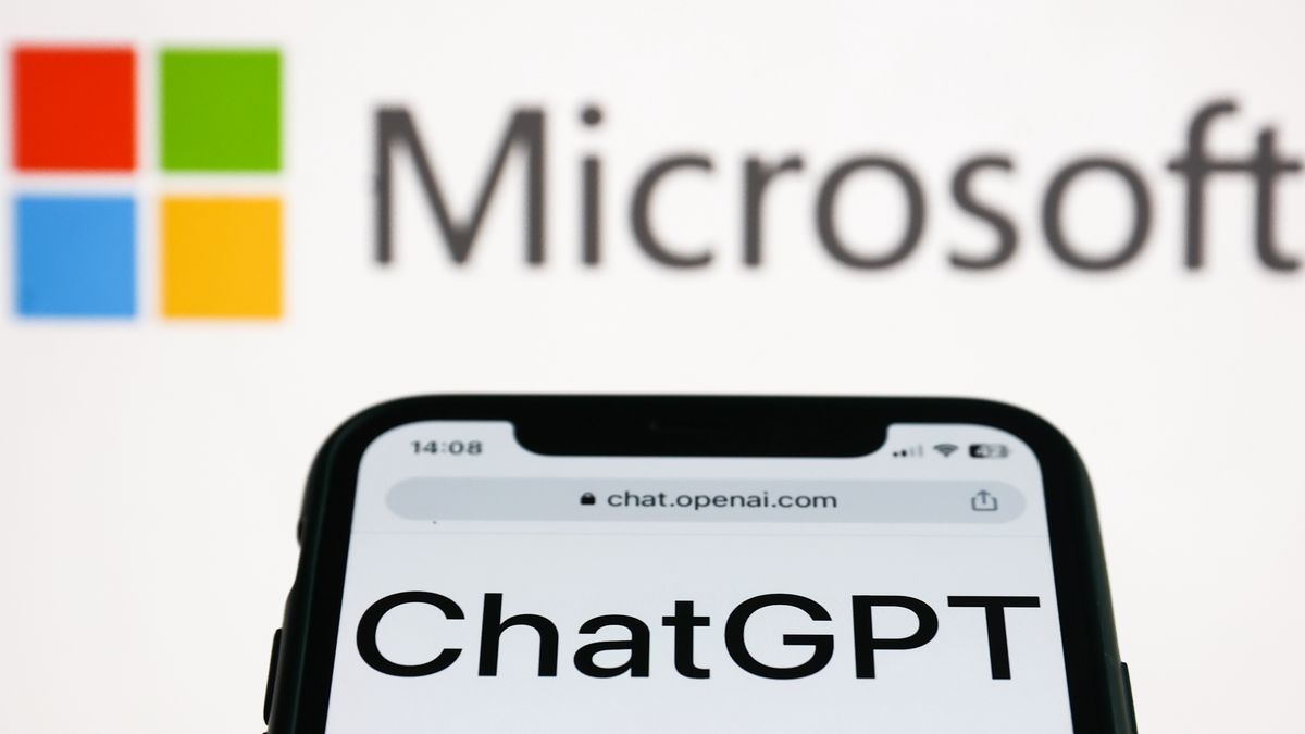 ChatGPT website displayed on a phone screen and Microsoft logo displayed on a screen in the background are seen in this illustration photo taken in Krakow, Poland on January 10, 2023. (Photo by Jakub Porzycki/NurPhoto via Getty Images)